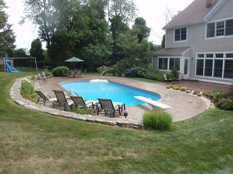Swimming pool and stamped concrete project example 54